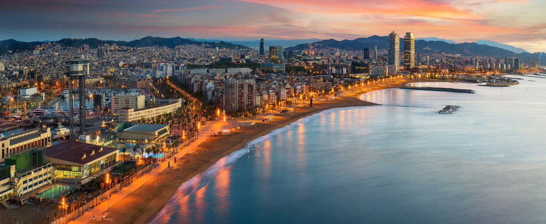 View of the beaches of Barcelona at sunset.