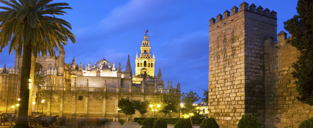 Night view of Seville, with La Giralda in the background