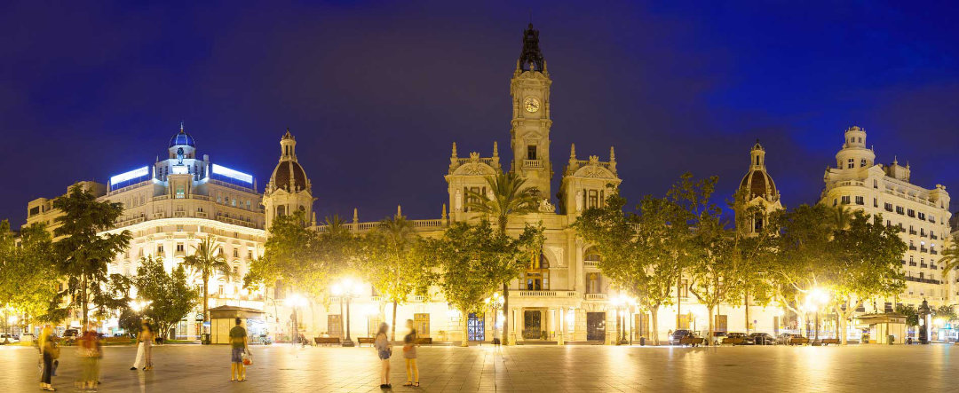 Panoramic view of the Town Hall Square at night.